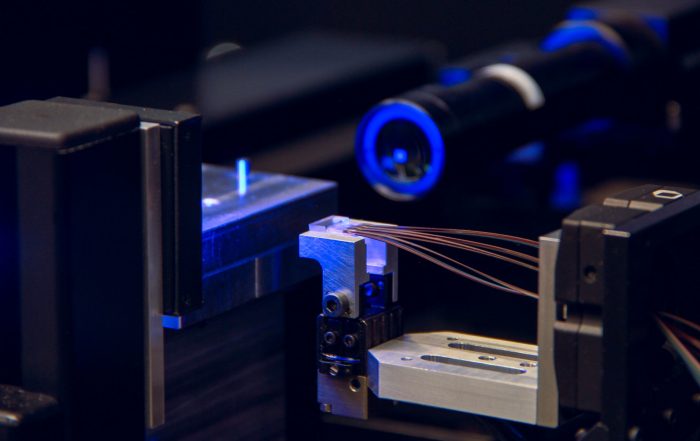 Machine setup ensuring precision in fiber optics assembly